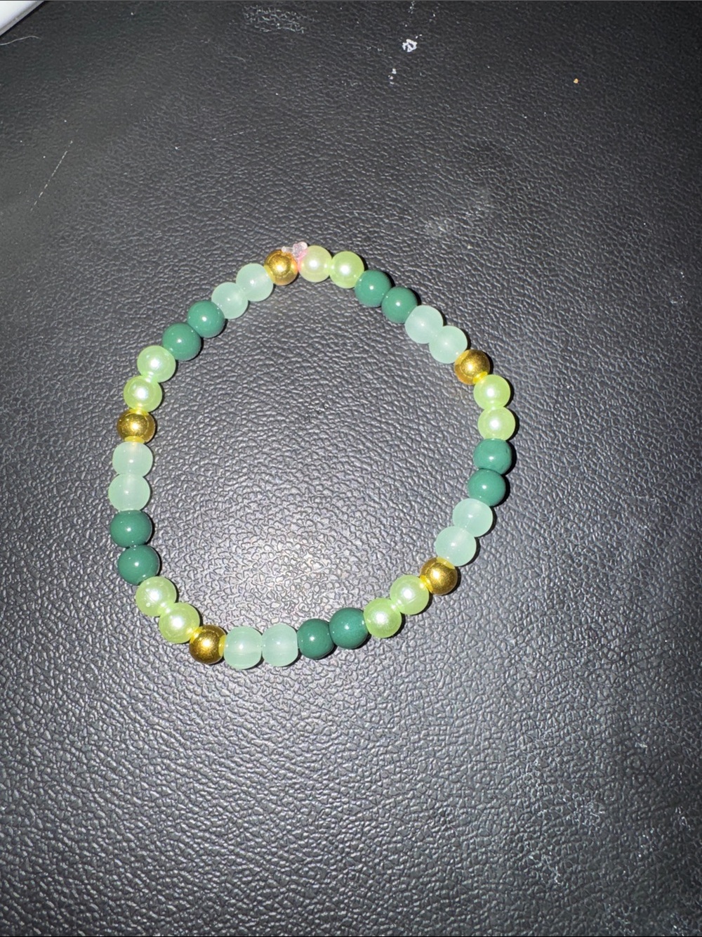Green Bead Stretch Bracelet with Gold Accent Beads